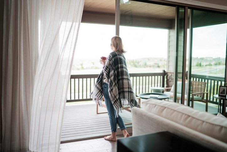 Resident overlooks outdoor patio in home in Anthem